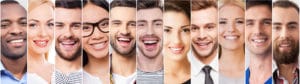 A row of smiling people after they visit a local dentist in Austin, TX