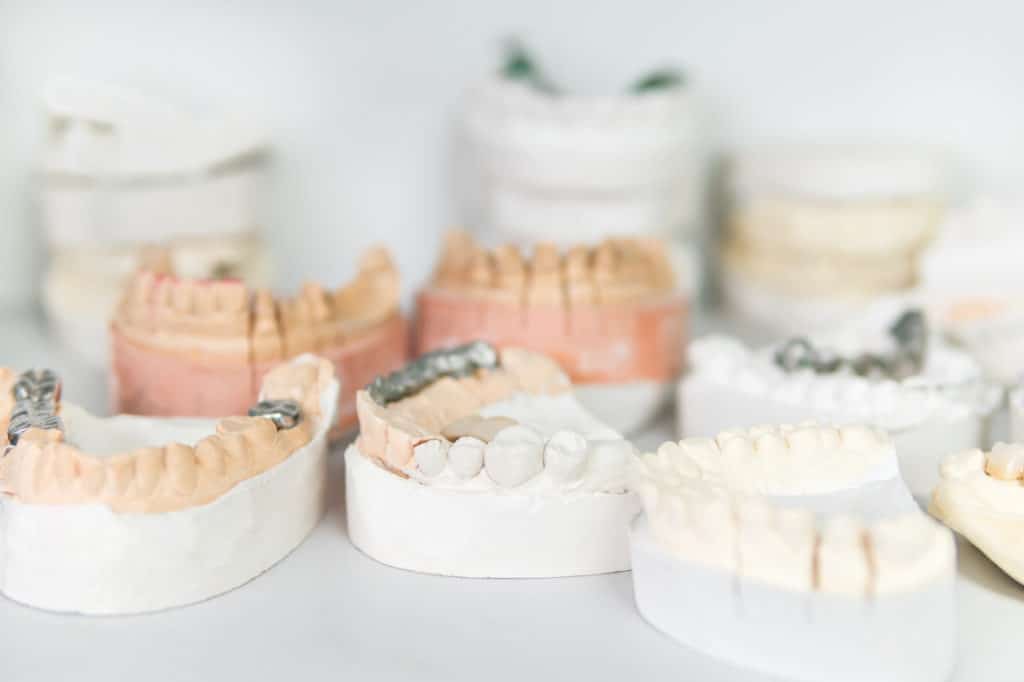 several dental restorations on white surface