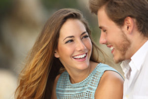 woman and man smiling at each other