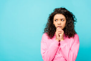 nervous woman on blue background