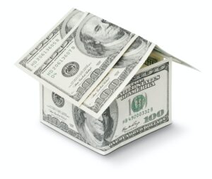 hundred dollar bills in the shape of a house