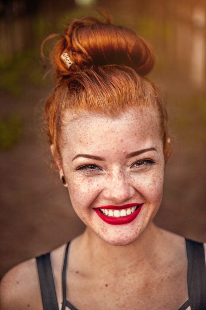 young redheaded woman with good oral health