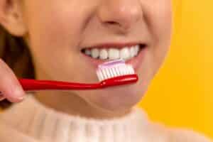 Close-up on girl brushing her teeth Austin, Texas, Dentistry Expert: 5 Ways to Improve Your Tooth Brushing Routine