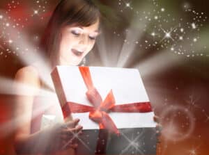 girl opening a Christmas gift