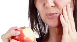 woman with a painful tooth